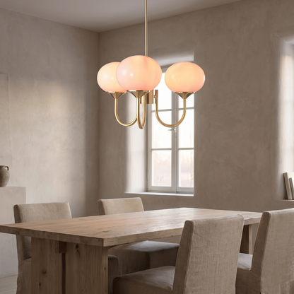 Bianca chandelier above an oak dining table