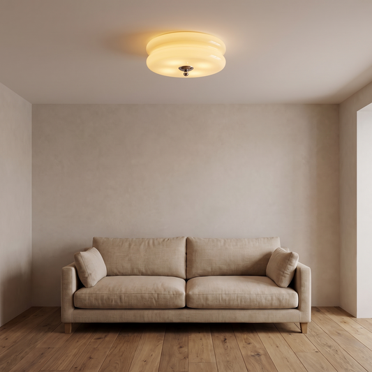 Gatsby flush mount glowing on a living room ceiling