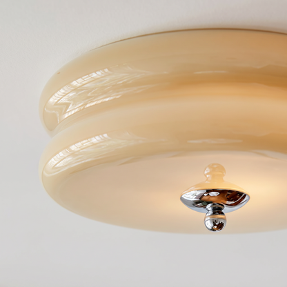 Close detail of the ribbed glass shade and chrome finial