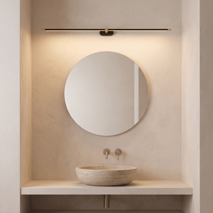 Lineo wall light above a round bathroom mirror