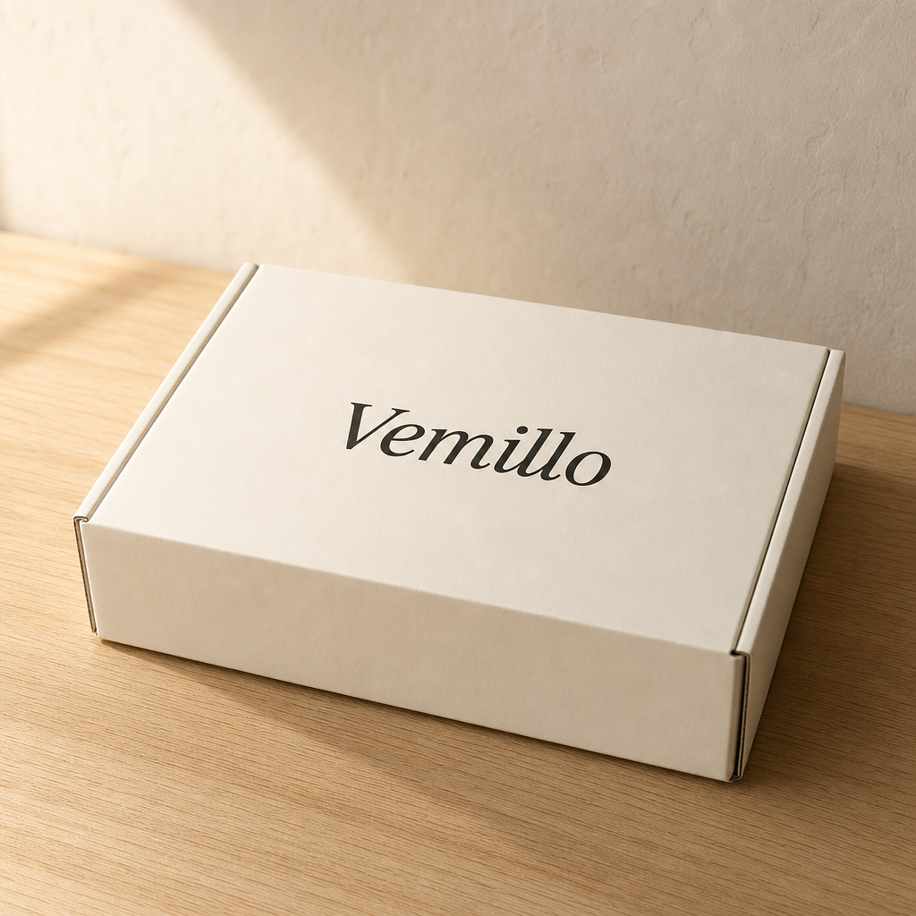 Vemillo branded shipping box on an oak table